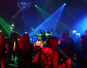 Silhouettes of dancing teenagers