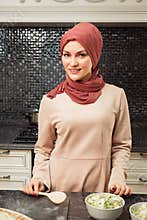 Islam woman in hijab makes salad cooking homemade meal