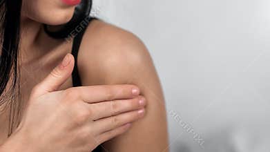 Hand female touching tender skin with lotion enjoy domestic bodycare. Closeup shot on pillow RED camera