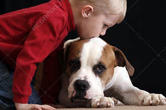Boy kissing dog