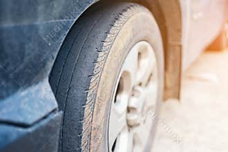Care use unsafe tire, Change time for a front wheel rubber worn, bald, black, old and low tread car tires. Driving on worn tires