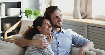 Dreamy loving couple enjoying romantic moment together indoors.