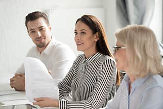 Businesswoman holding document, sharing ideas at business briefing