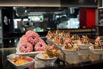 Dessert in catering buffet with open kitchen