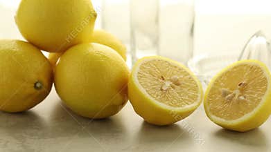 Whole and half fresh lemon ready to press