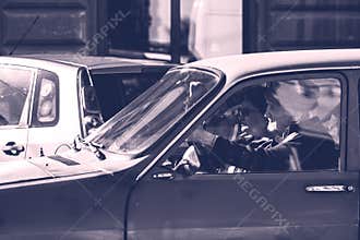 Driving old Dacia 1300 close up isolated. Couple in Dacia 1300 romanian vintage car on the streets of Lugoj, Romania, 2020