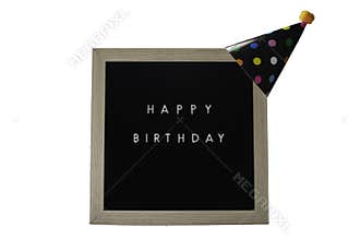 A Sign That Says Happy Birthday With a Black Party Hat on Top on a White Background