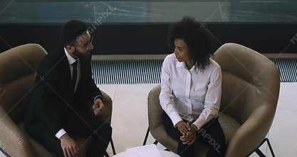 Happy male arabic manager talking handshaking african female client