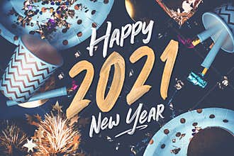 2021 happy new year hand brush storke font on marble table with party cup,party blower,tinsel,confetti.Fun Celebrate holiday party