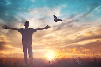 Happy man rise hand on morning view. Christian inspire praise God on good friday background. Male self confidence empowerment on