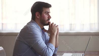 Thoughtful businessman lost in thoughts at work search for inspiration