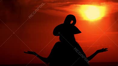 Outdoors silhouette sorceress conjures with a potion