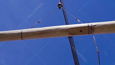 Crane lifts the log. Clip. Crane lifts timber for the construction of a wooden house