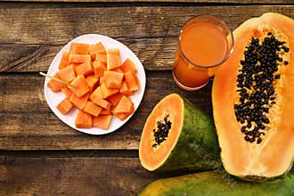 Flat lay composition with fresh papayas and juice