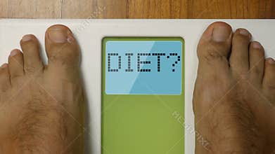 Closeup male feet on scale DIET display at morning 4k footage top view