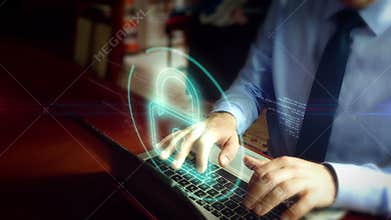 Man typing on keyboard with cyber safety hologram