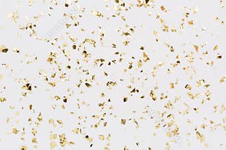 Golden confetti on white background Festive party or holiday glitter backdrop