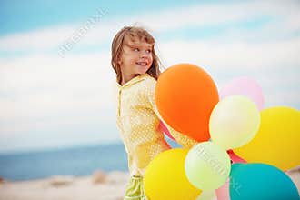 Little girl with balloons