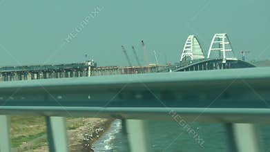 The car goes along the Crimean bridge