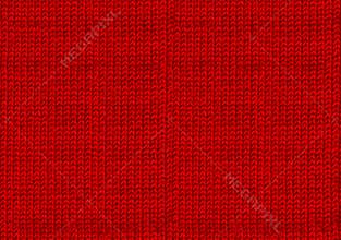 Red knitted woolen christmas background. The atmosphere of a warm sweater. New year wallpaper. Texture of the wool or acrylic knit