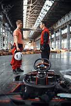 Two kart racers in equipment, karting auto sport