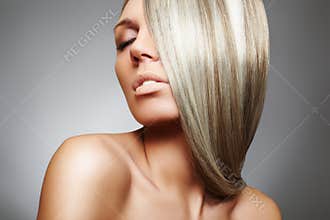 Beautiful woman model with long blond smooth hair