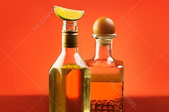 Two tequila bottles with lime