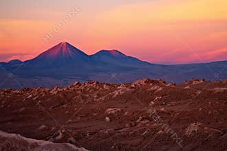 Sunset over volcanoes and Valle de la Luna, Chile