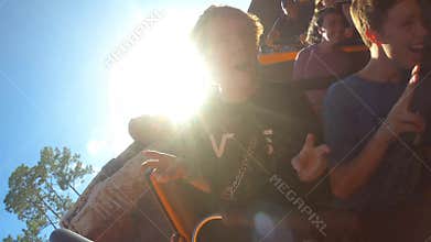 Funny brothers enjoying Big Thunder Mountain Raildroad rollercoaster at Magic Kingdom.