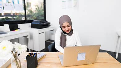 4K Hyperlapse time lapse of beautiful Asian muslim woman working using laptop in modern office. Small business company owner