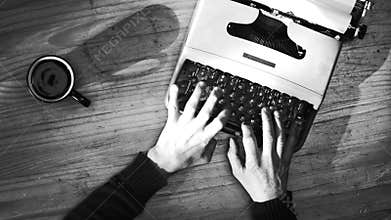 Black and white typing on a vintage typewriter machine. Writing a love letter by the window, 4K
