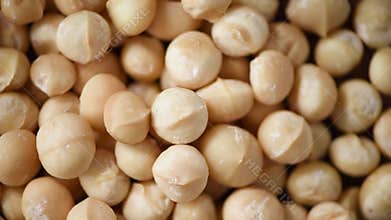 Macadamia nuts rotation. Food ingredient background. Vegan, vegetarian diet. Healthy lifestyle. Natural dry fruits and