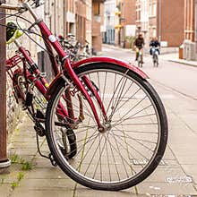 A red bike in the foreground, Fun bike ride in the background