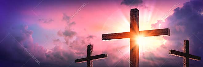 Three Wooden Crosses With Sunrise And Clouds