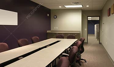 Office conference / workspace with purple wall