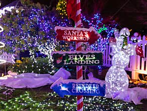 Signpost at Victorian Belle mansion during The Miracle of Million lights