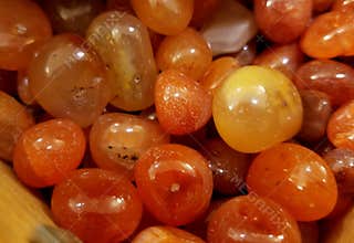 A pile of beautiful Banded Carnelian Botswana natural stones