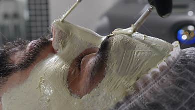 Spa therapy for handsome man getting rejuvenating facial treatment. cosmetology and beauty concept. Concept of men