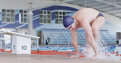 Swimmer coming out of pool