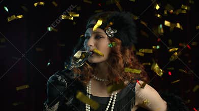 Portrait of vintage styled woman dressed in Roaring twenties time makes gesture like toast and drinking champagne under