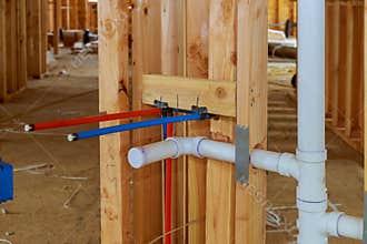 New residential construction house framing a plumbing the laundry room