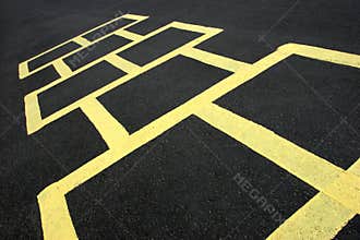 Hopscotch game yellow on pavement