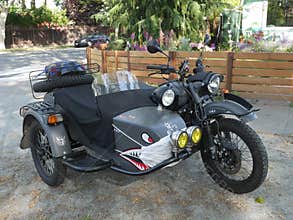 Funny motorcycle with sidecar Corona