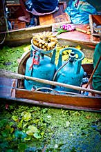 Gas bottles in a small boat in the floating market