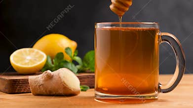 Adding honey into tea