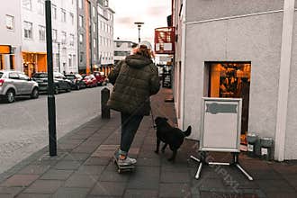 Boy teenager walking with dog city street social distance