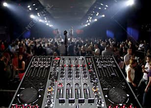 DJ desk in a nightclub party with lightshow