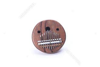 Kalimba African folk music instrument on white background at 45 degrees right