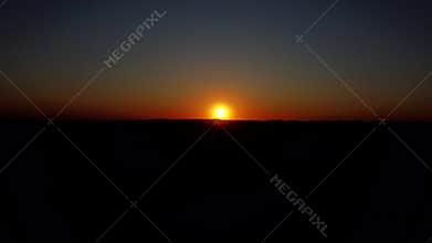 Aerial Shot Of Red Sunrise with colorful Sky Over Dark Forest,Cinematic