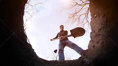 A man digs a grave